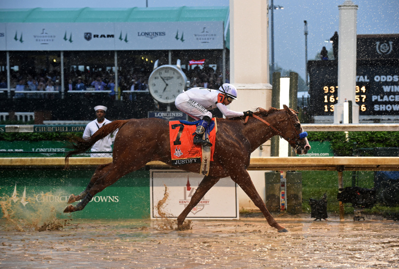 Justify, ridden by jockey Mike Smith, wins the 144th Kentucky Derby, the wettest in history, on Saturday, May 5, 2018, at Churchill Downs in Louisville, Ky. Longines, the Swiss watch manufacturer known for its luxury timepieces, is the Official Watch and Timekeeper of the 144th annual Kentucky Derby. (Photo by Diane Bondareff/Invision for Longines/AP Images)