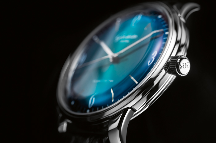 Domed dials and curved hands grace the watch