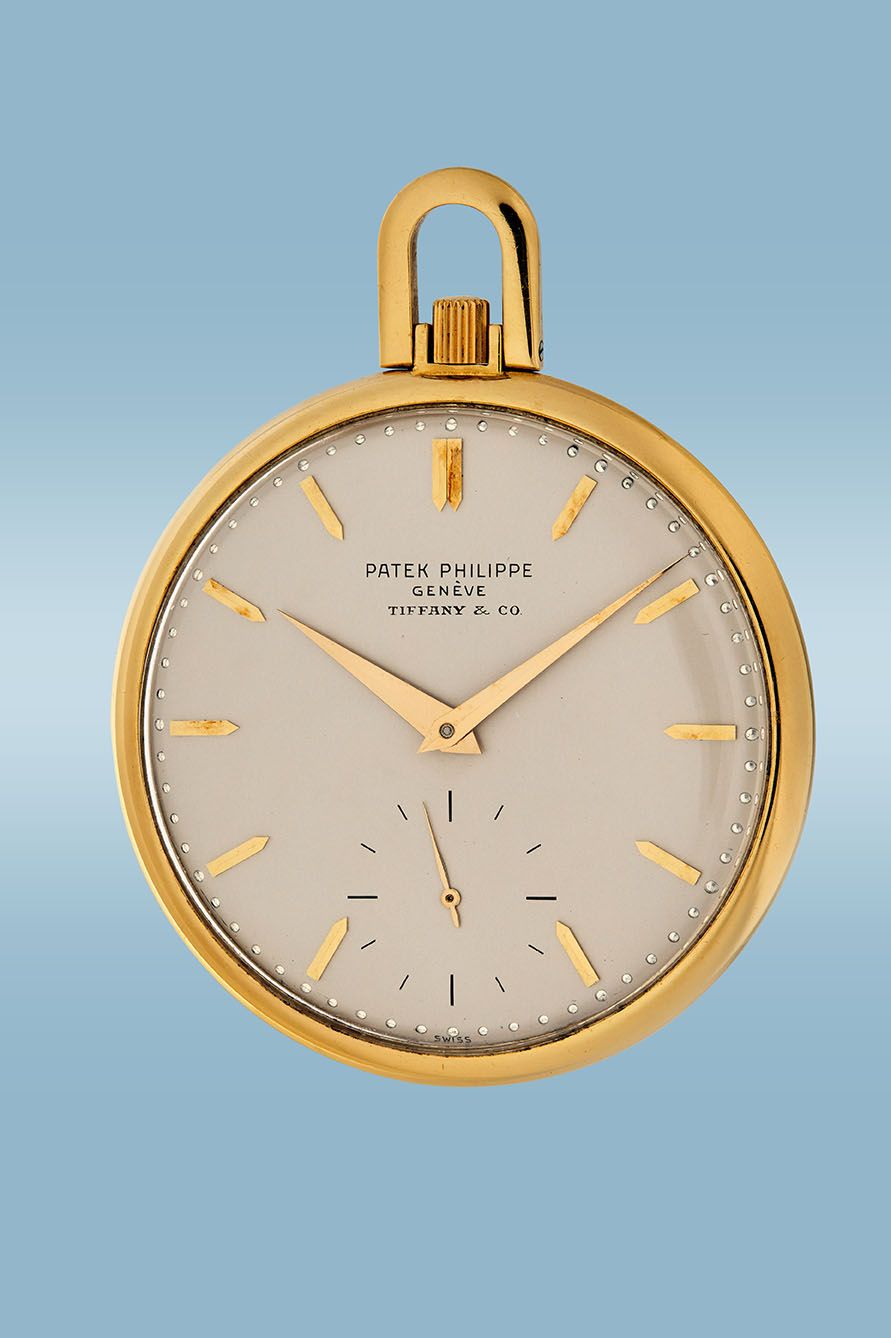 •Lot 7 — PATEK PHILIPPE, Reference 715, open-face pocket watch retailed by Tiffany & Co., 18K yellow gold, circa 1967. Donated by Collectability.
