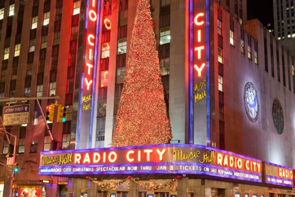 The massive tree at Radio City Music Hall is installed piece by piece, and requires closing the street over night. 