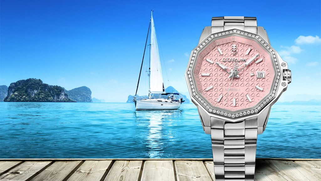 Corum Admiral 38 Automatic watch with pink dial and strap.