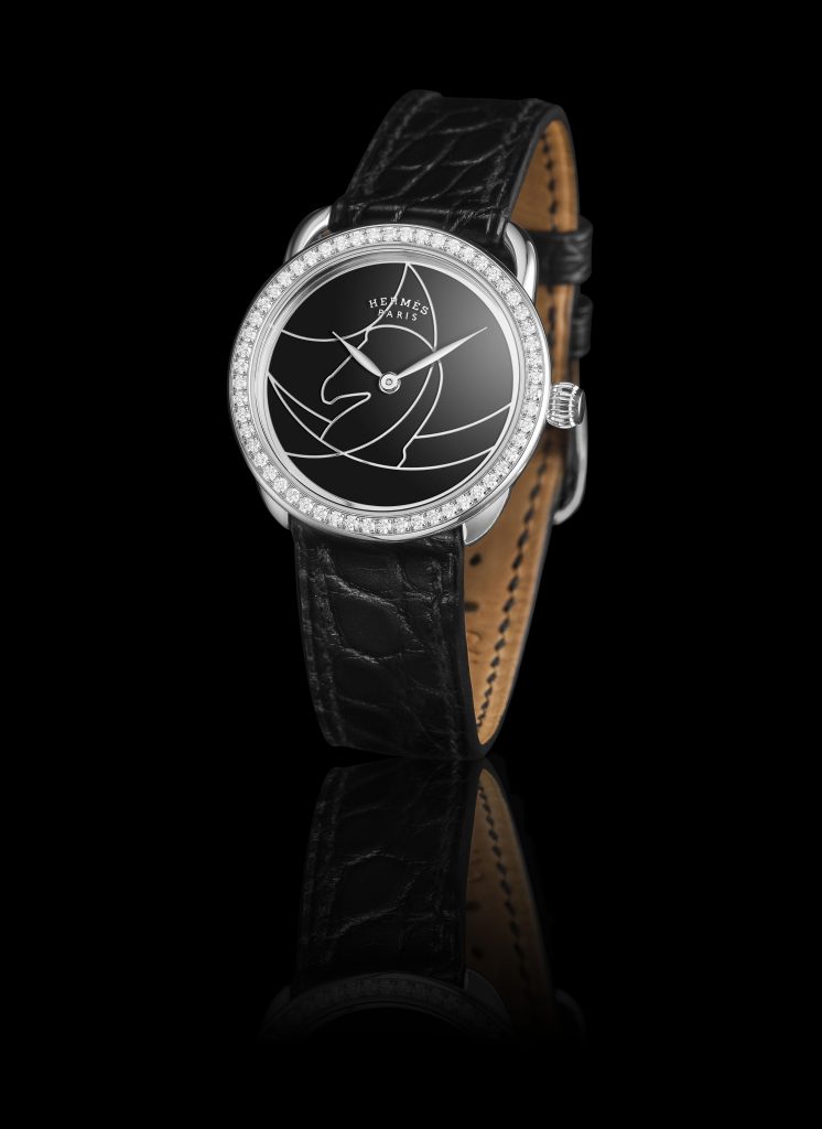 Hermes Arceau Cavils watch in black lacquer with horse motif. 
