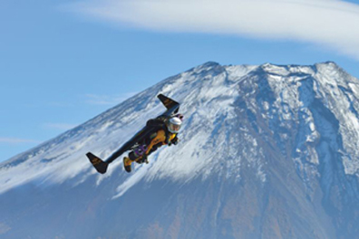 Jetman wears a jet-powered wing in flight. 