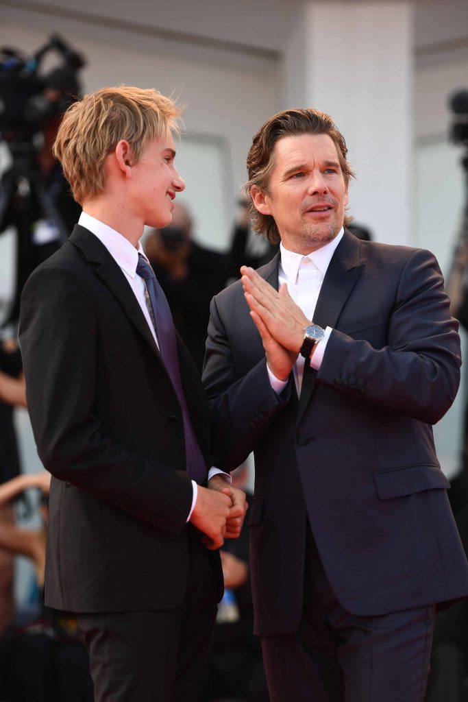 VENICE, ITALY - AUGUST 31: Actor Ethan Hawke wearing a Jaeger-LeCoultre Master Ultra Thin Moon watch with his son Levon Roan Thurman-Hawke (L) walks the red carpet during the 'First Reformed' premiere during the 74th Venice Film Festival at Sala Grande on August 31, 2017 in Venice, Italy. (Photo by Ian Gavan/Getty Images for Jaeger-LeCoultre) *** Local Caption *** Ethan Hawke; Levon Roan Thurman-Hawke
