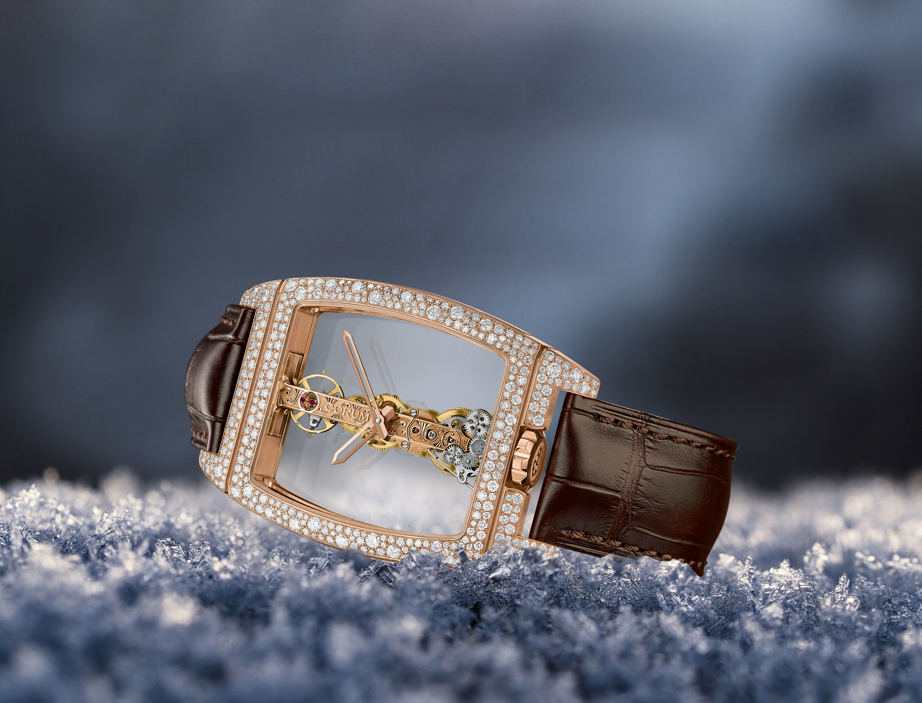 Corum Golden Bridge and Miss Golden Bridge with snow-set diamond cases.