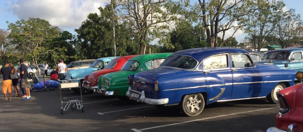 One step outside the Havana airport and you feel as though you have been transported in time. Dozens of old cars wait to transport people. (Photo: R. Naas) 