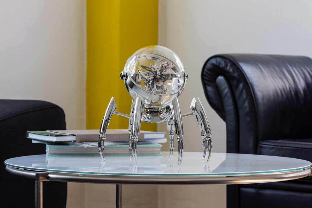 Seen here in the palladium version, the MB&F Octopod clock has legs that are adjustable to different heights. 
