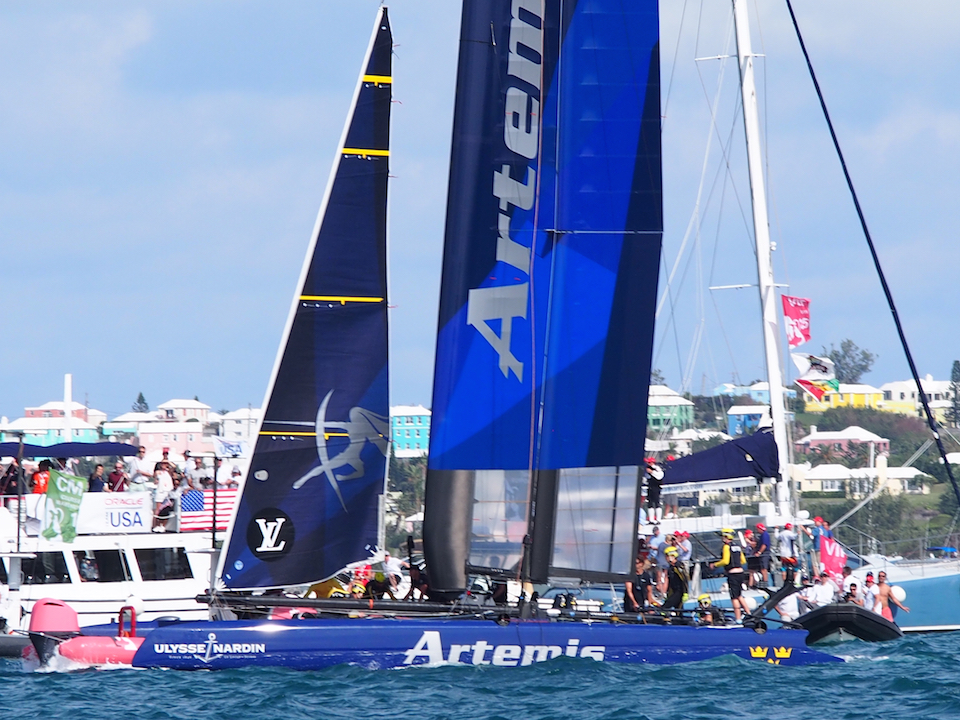 The small pink boat got lodged underneath the front of Artemis Racing 