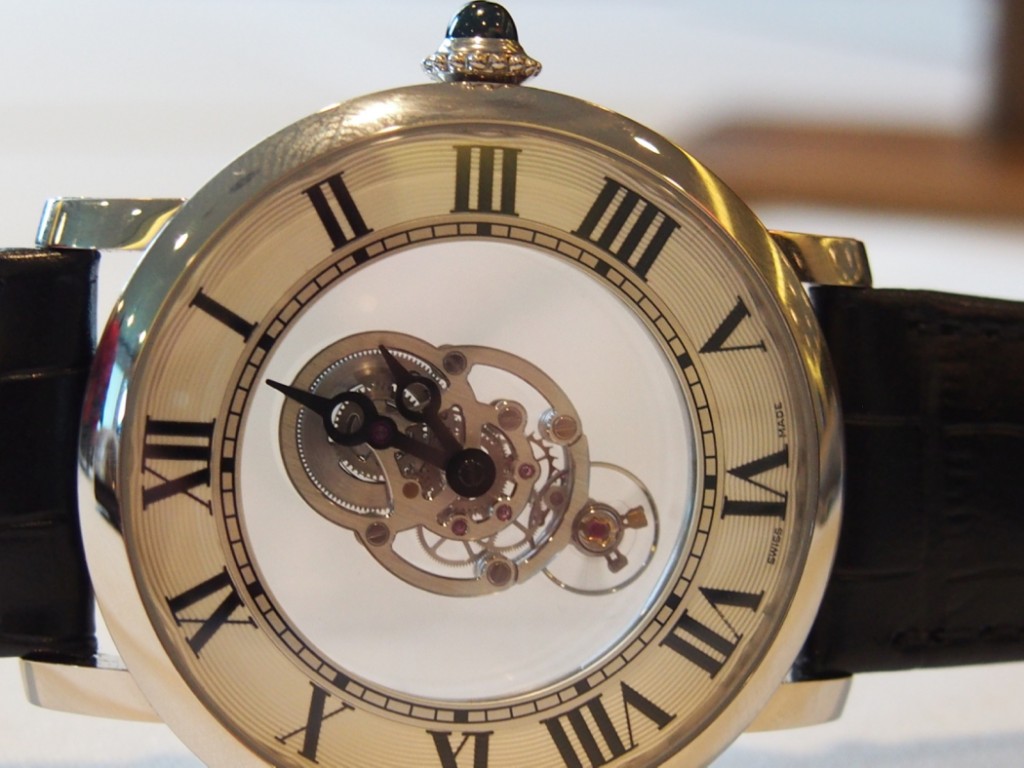 The non-visible parts of the 408-part movement are relinquished to areas behind the outer guilloche dial.