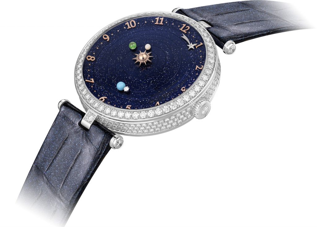 The Van Cleef & Arpels Lady Arpels Planetarium watch features three planets rotating around the sun. 