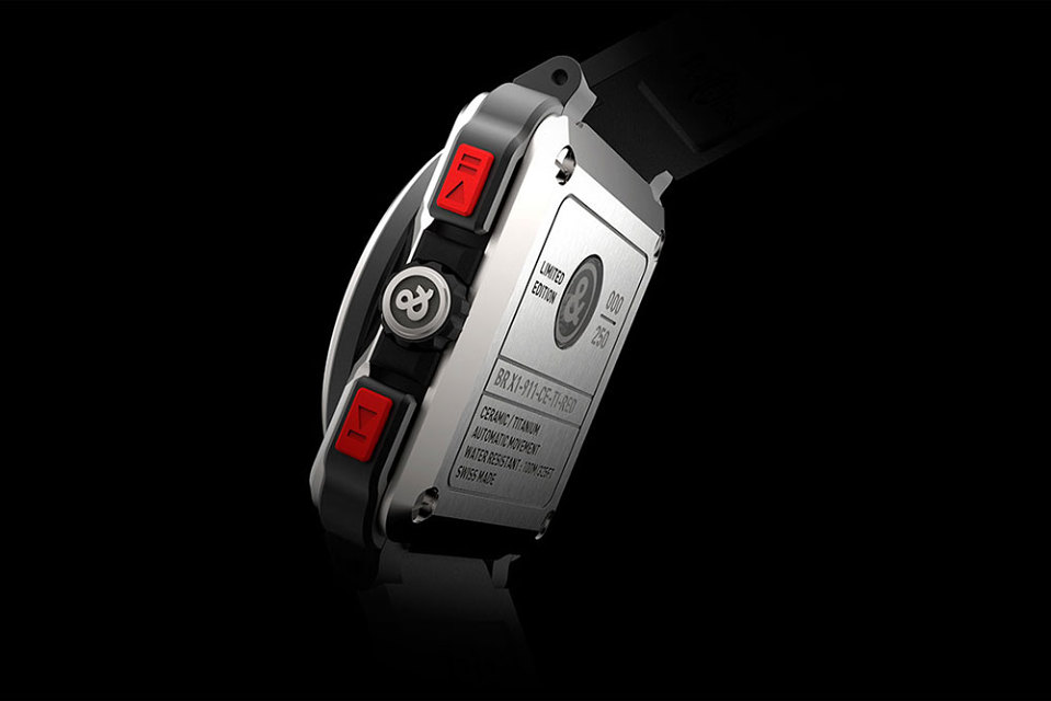 Red rubber inserts and ceramic elements complement the titanium case. 
