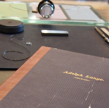 A copy of Adolph Lange's journal, with our watchmaking tools in the background