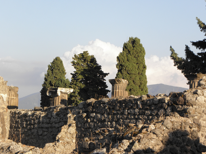 An outer wall of the city of Pompeii with Mt. Vesuvius in the background. 
