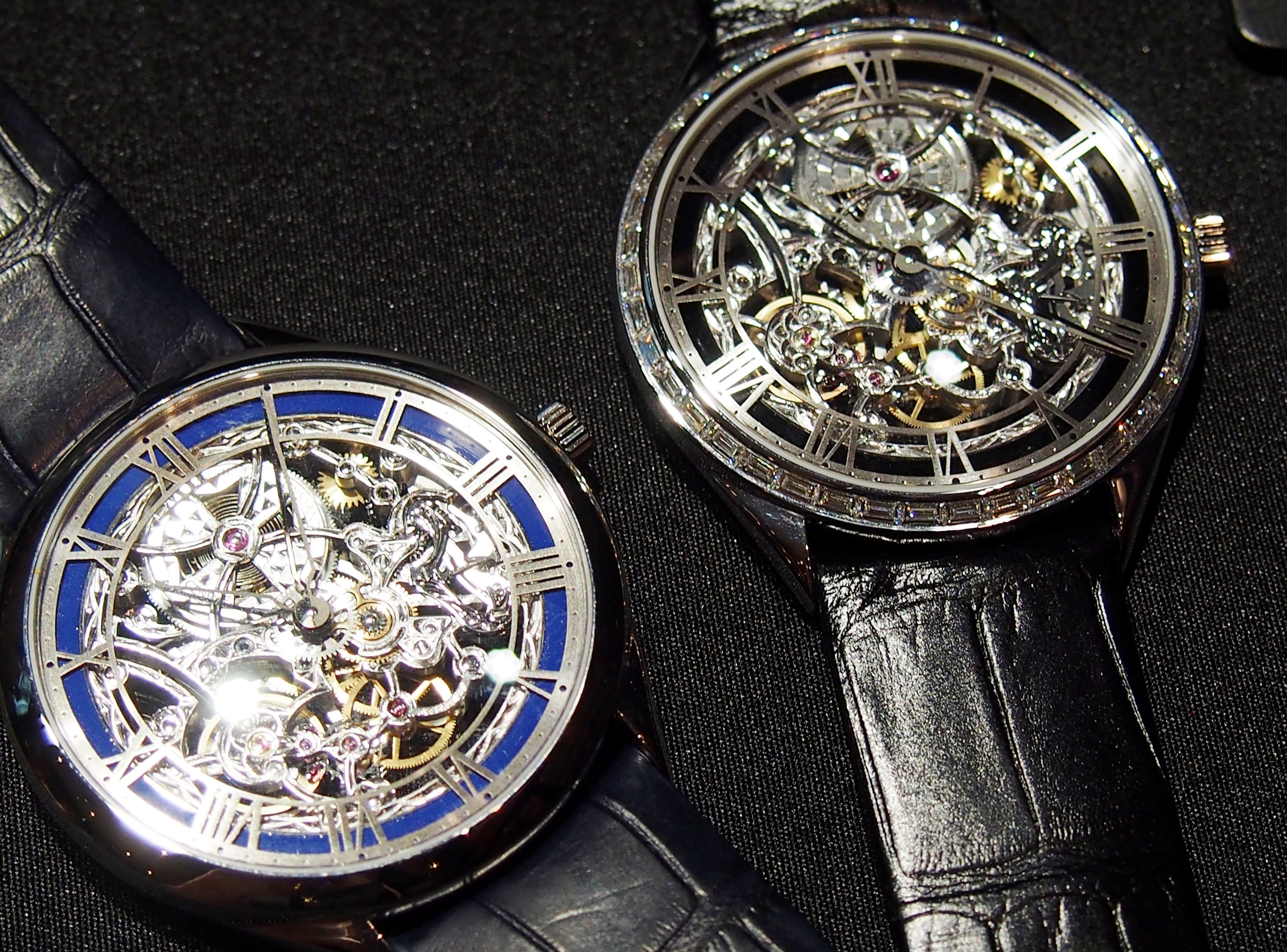 The new skeletonized watches feature blue, gray or black Grand Feu enamel inner rings. 