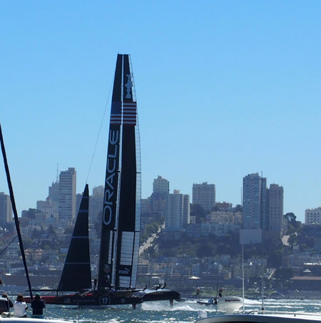 The new 72-foot wing sail catamarans seem to fly out of the water at great speeds.