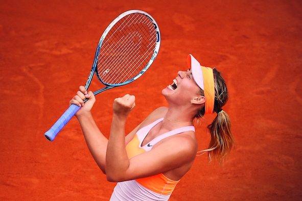 Maria Sharapova of Russia celebrates a point during her women's singles final match against Simona Halep of Romania on day fourteen of the French Open